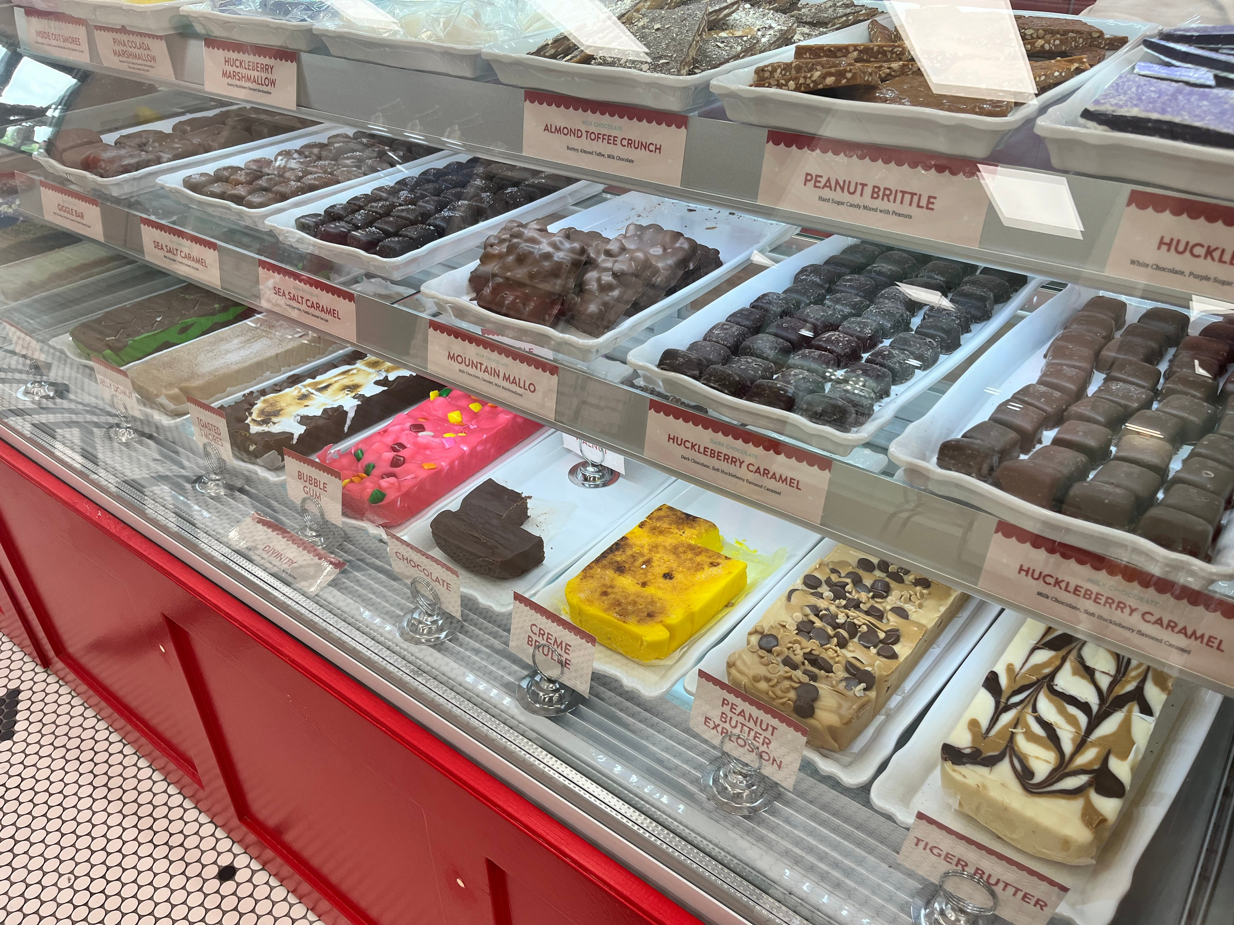 Explore Candy Town USA's homemade confections, featuring treats like fudge and chocolate-covered caramels.